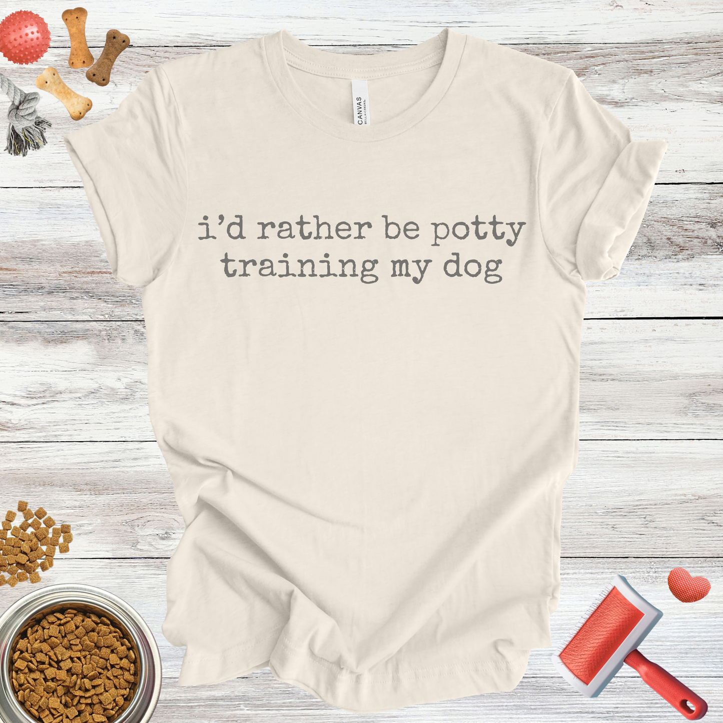 I'd Rather Be Potty Training My Dog dog t-shirt in Natural — Paw Shaped Love