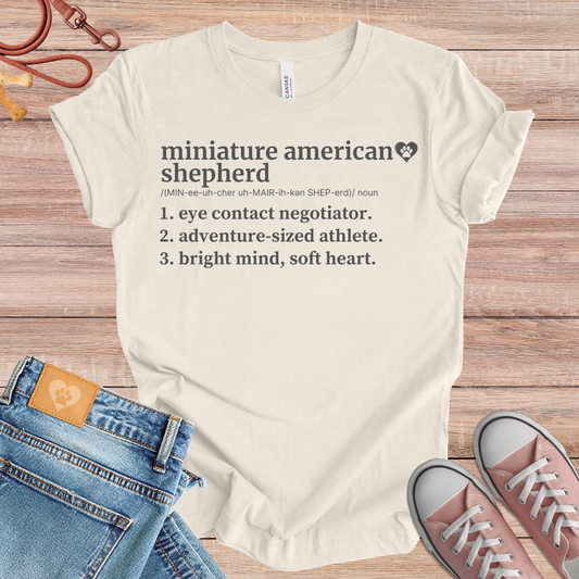 Miniature American Shepherd definition Tee dog t-shirt in Natural — Paw Shaped Love